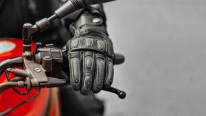 close-up on man’s hand on motorcycle