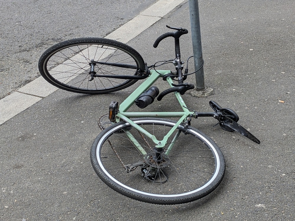 bicycle laying on the road